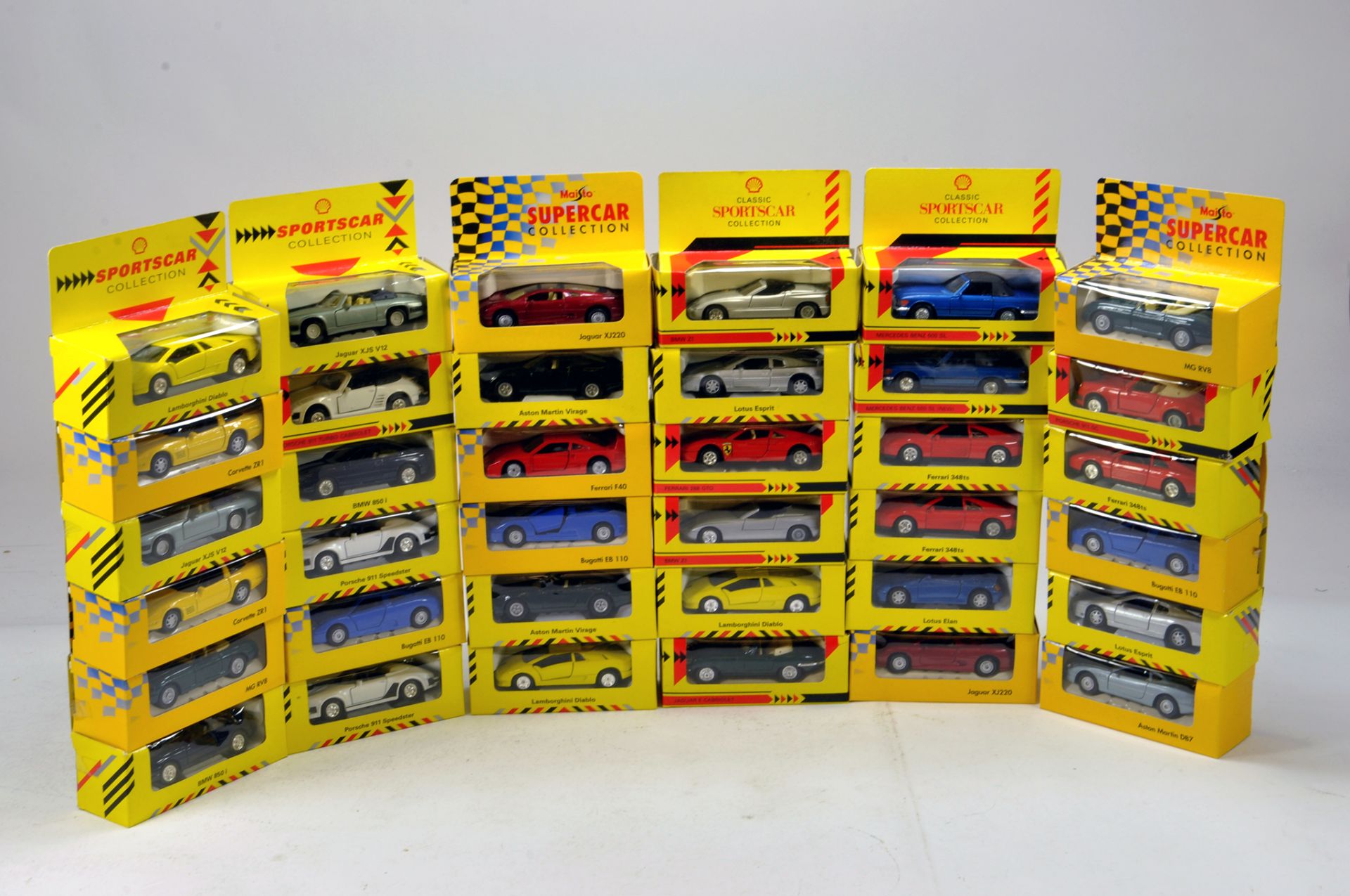 Large assortment of Shell Classic Sportscar Diecast issues. E to NM in Boxes.