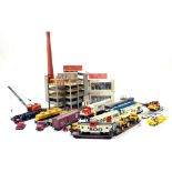 An interesting assortment of construction related models and accessories including building and
