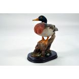 A static presentation piece comprising a Duck on branch. Fine Model with Box.