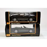 Maisto 1/18 diecast duo comprising Porsche Cayenne and Jaguar XK8. E to NM in Boxes.