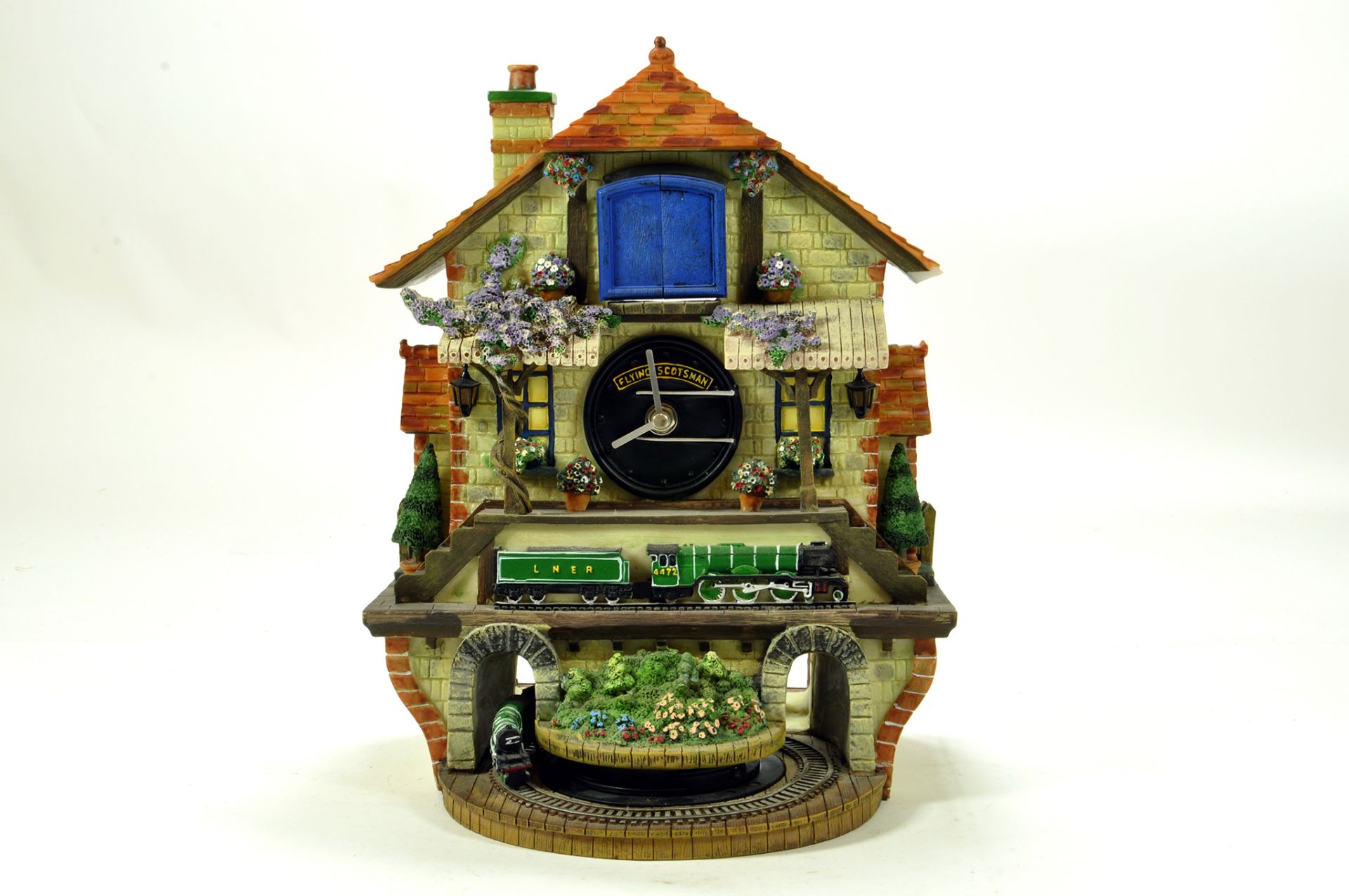 A fine presentation Cuckoo Clock, featuring the Flying Scotsman complete with Box.