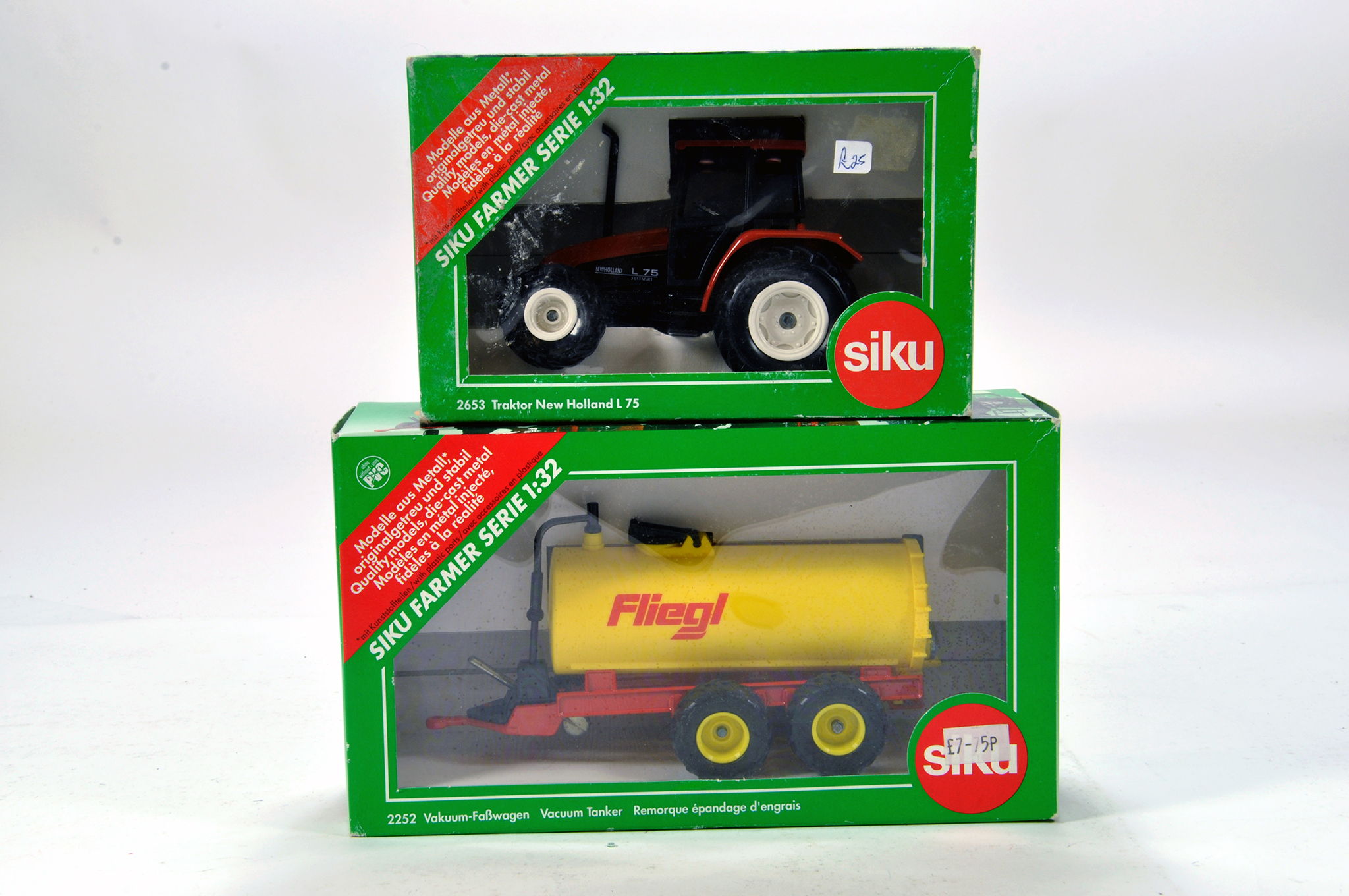 Siku 1/32 Farm issues comprising New Holland Fiat L75 Tractor and Fligel Tanker. NM in Boxes. (2)