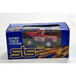 Vintage Scalextric STS System issue comprising Nissan Off Road 4X4. Untested but appears VG in Box.