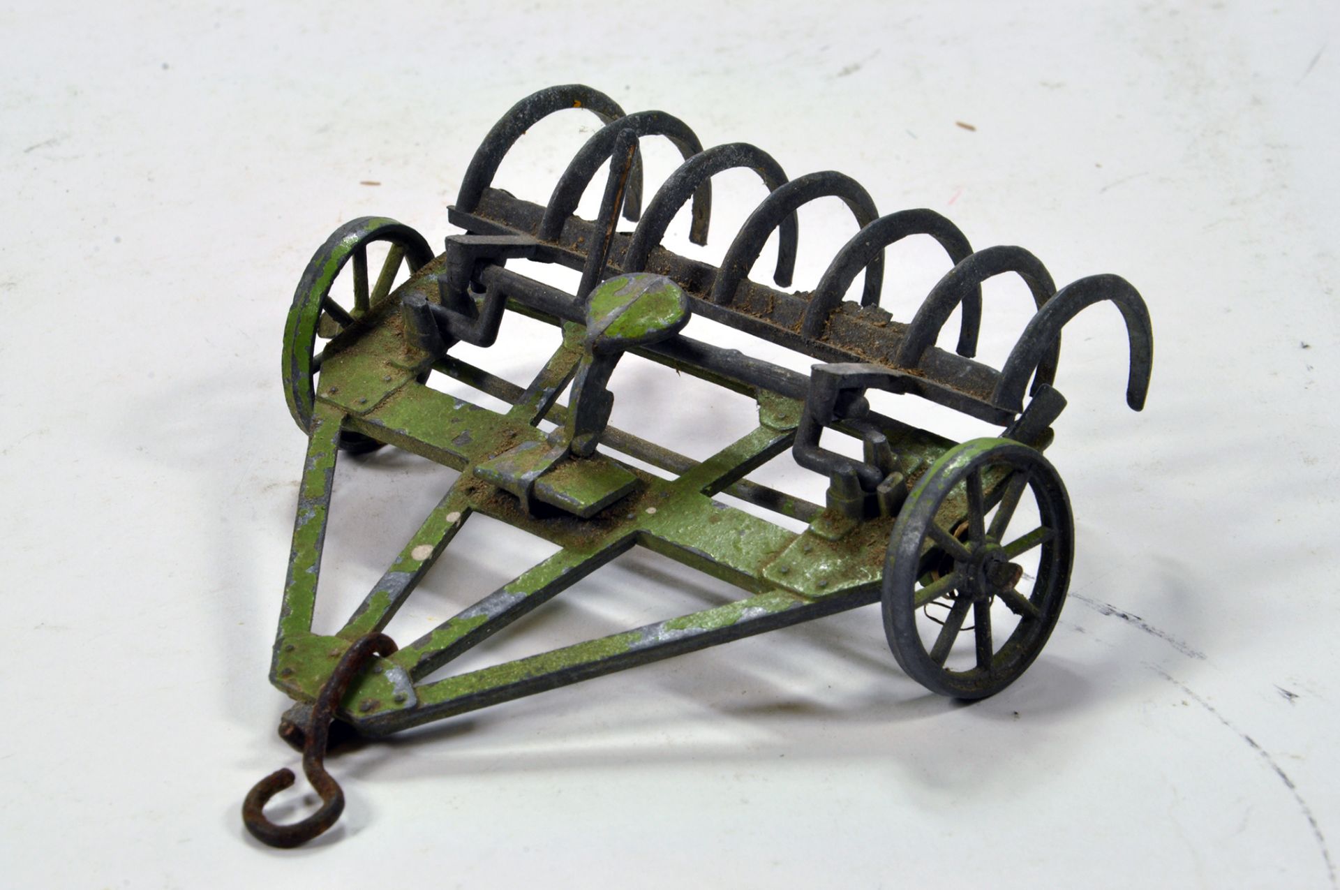 Scarce example of a Moko Farm Rake in green. Some cleaning needed, hook replaced otherwise a rare