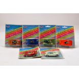 An assortment of carded diecast cars by Tins Toys. E to NM.