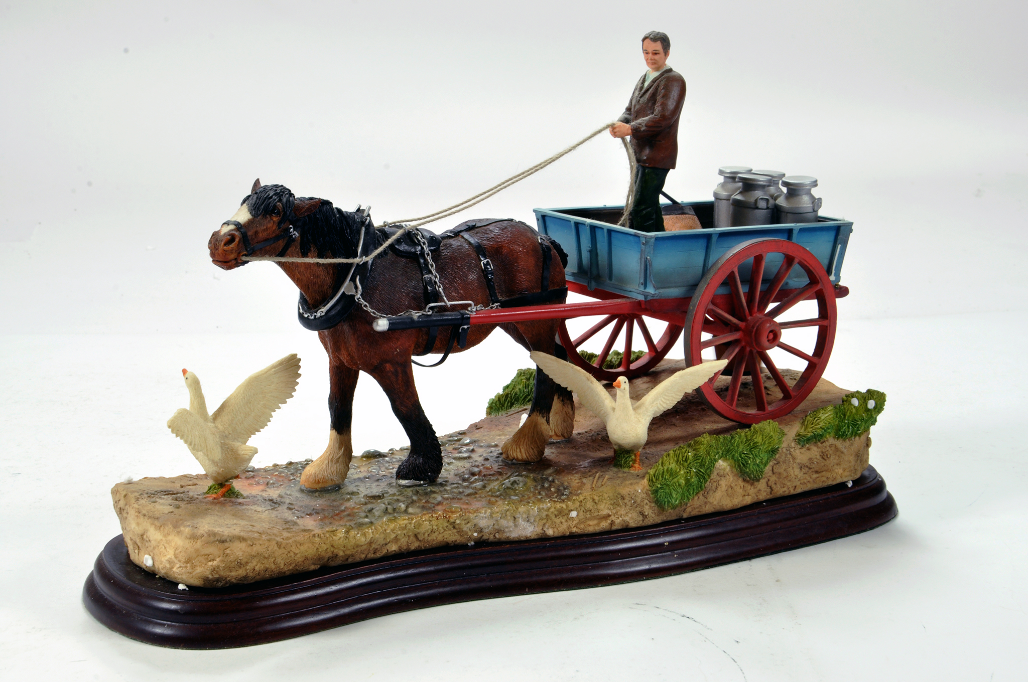 A static presentation piece comprising a Steady Steady, a Border Fine Art Shire Horse and Cart.