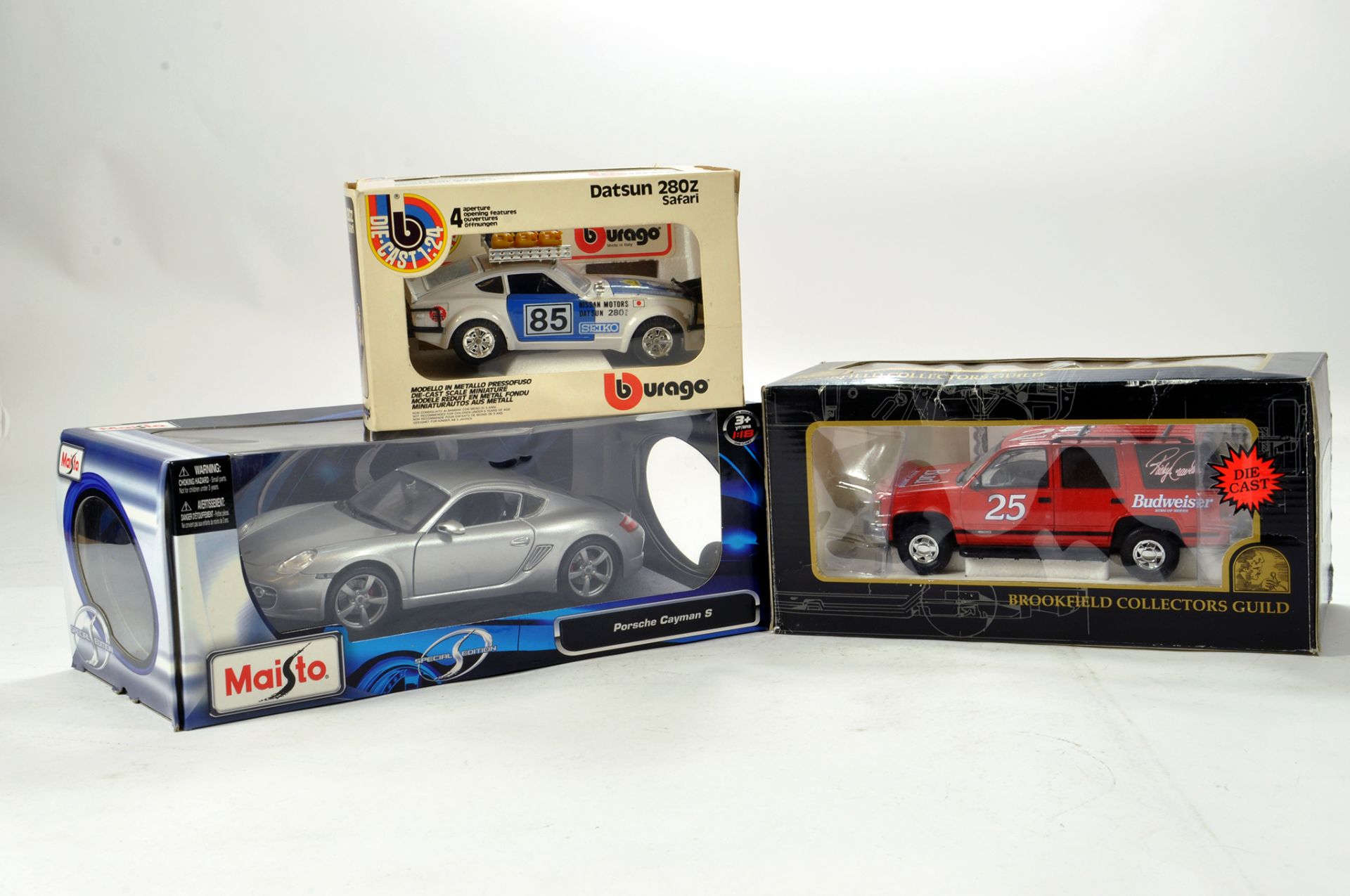Burago 1/24 Datsun Rally issue, Maisto Porsche plus Promotional Budweiser issue. E to NM in