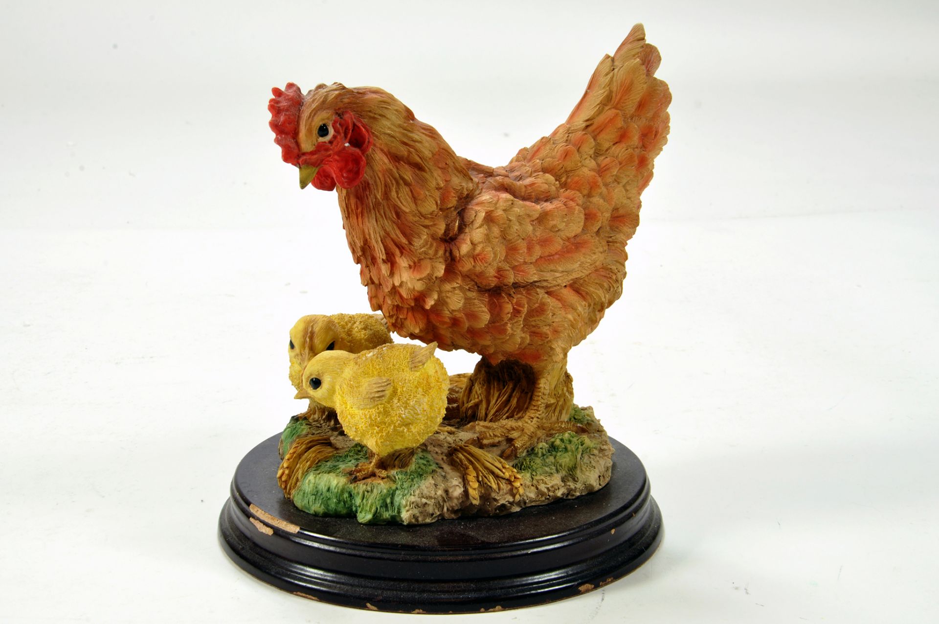 A static presentation piece comprising a Chicken and Chicks. Fine Model with Box.