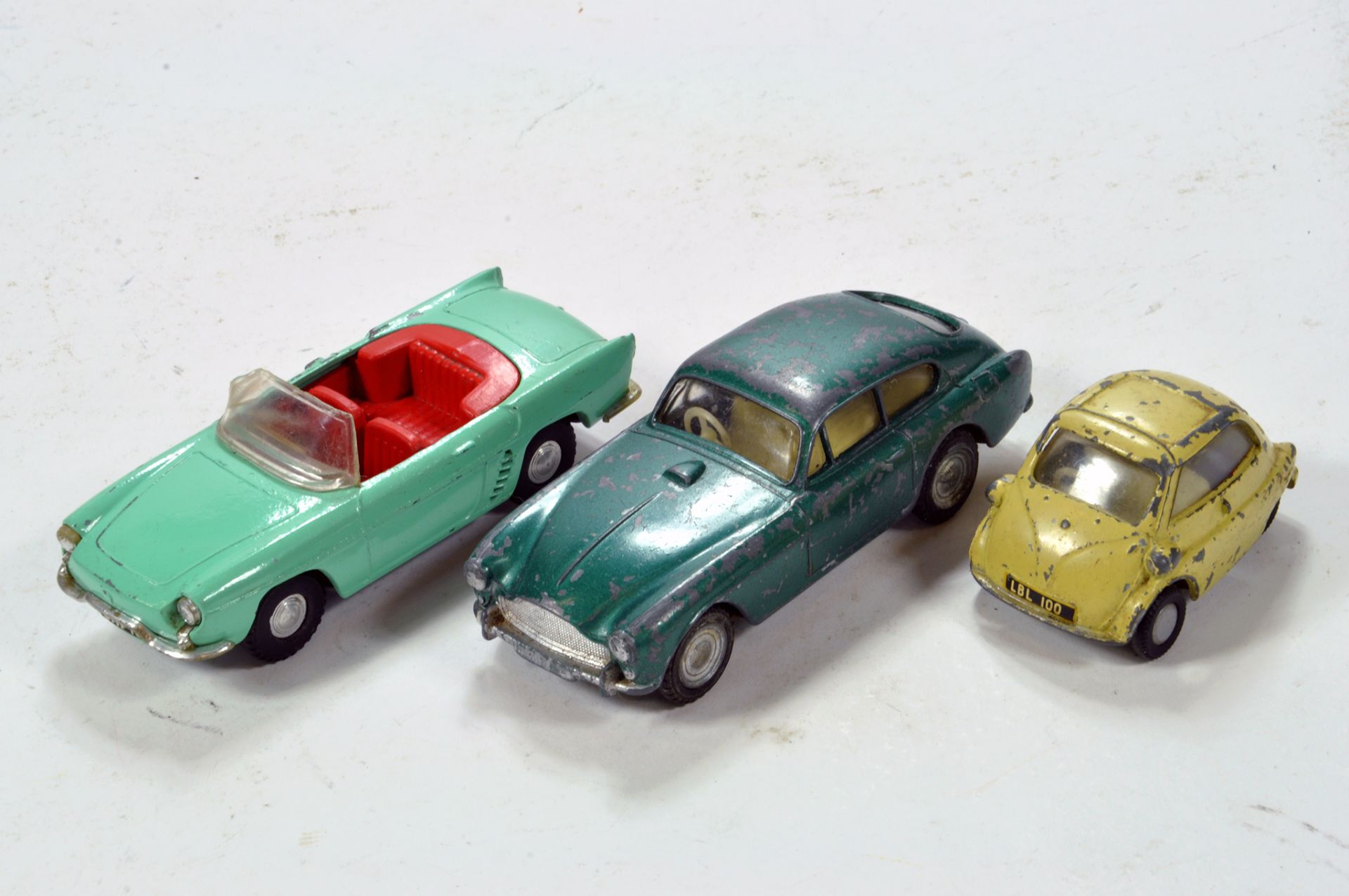 Spot-On diecast vehicle trio including Aston Martin and others. F to G. (3)