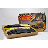 Vintage Scalextric Set No. 80. Appears complete containing cars, track and accessories. Box is F.