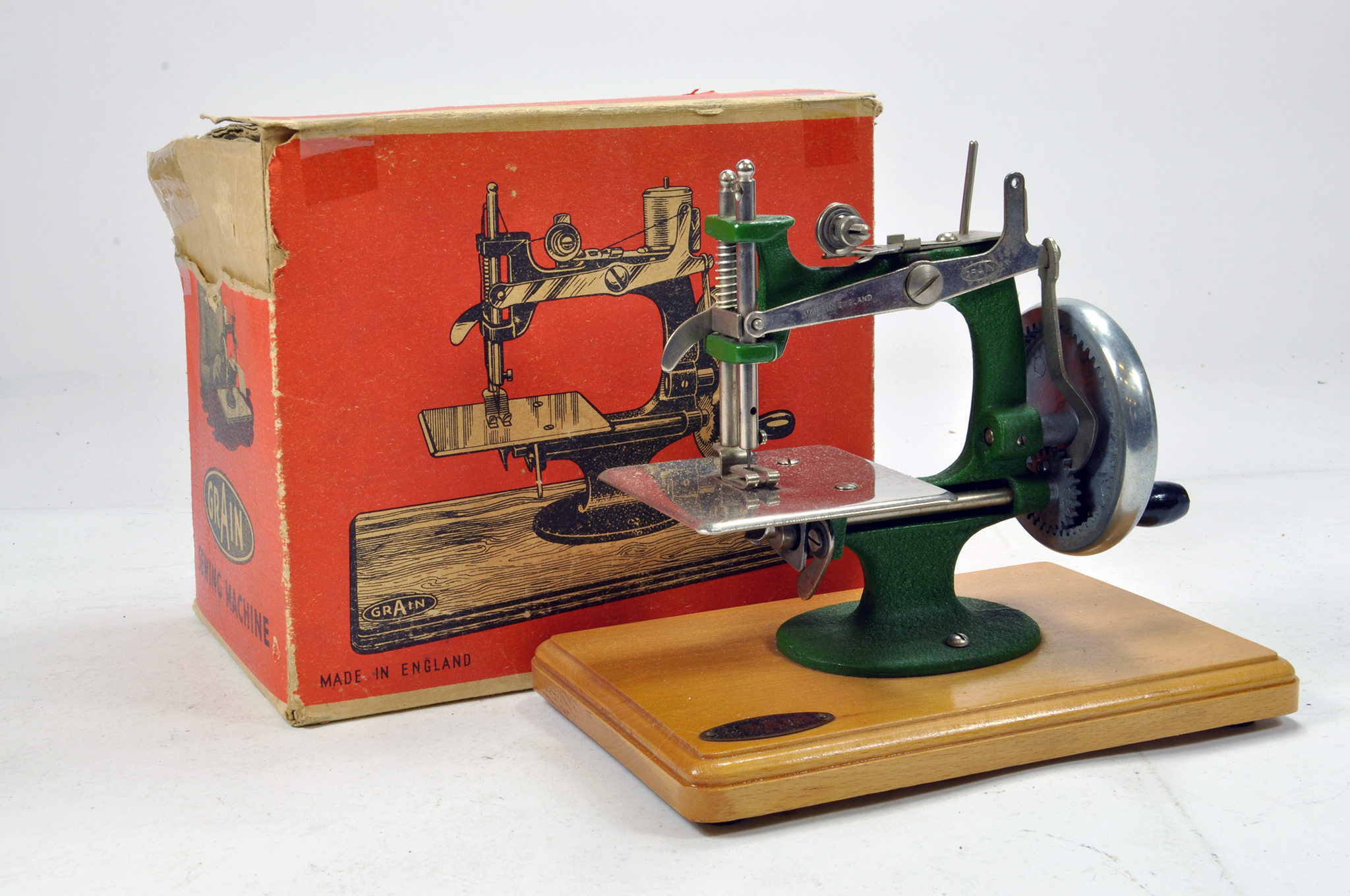 An original GRAIN of England Sewing Machine with Box. Untested but displays well.