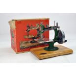 An original GRAIN of England Sewing Machine with Box. Untested but displays well.