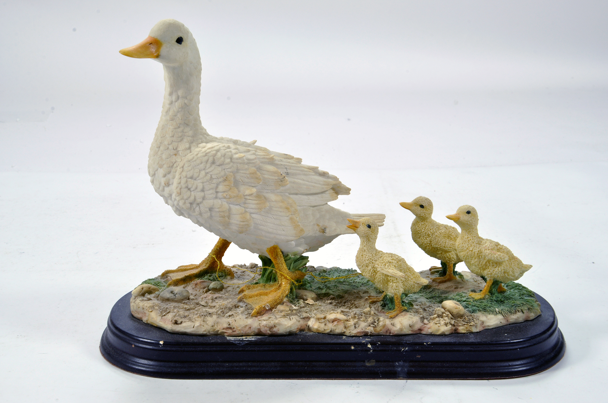 A static presentation piece comprising a Duck and Ducklings. Fine Model with Box.