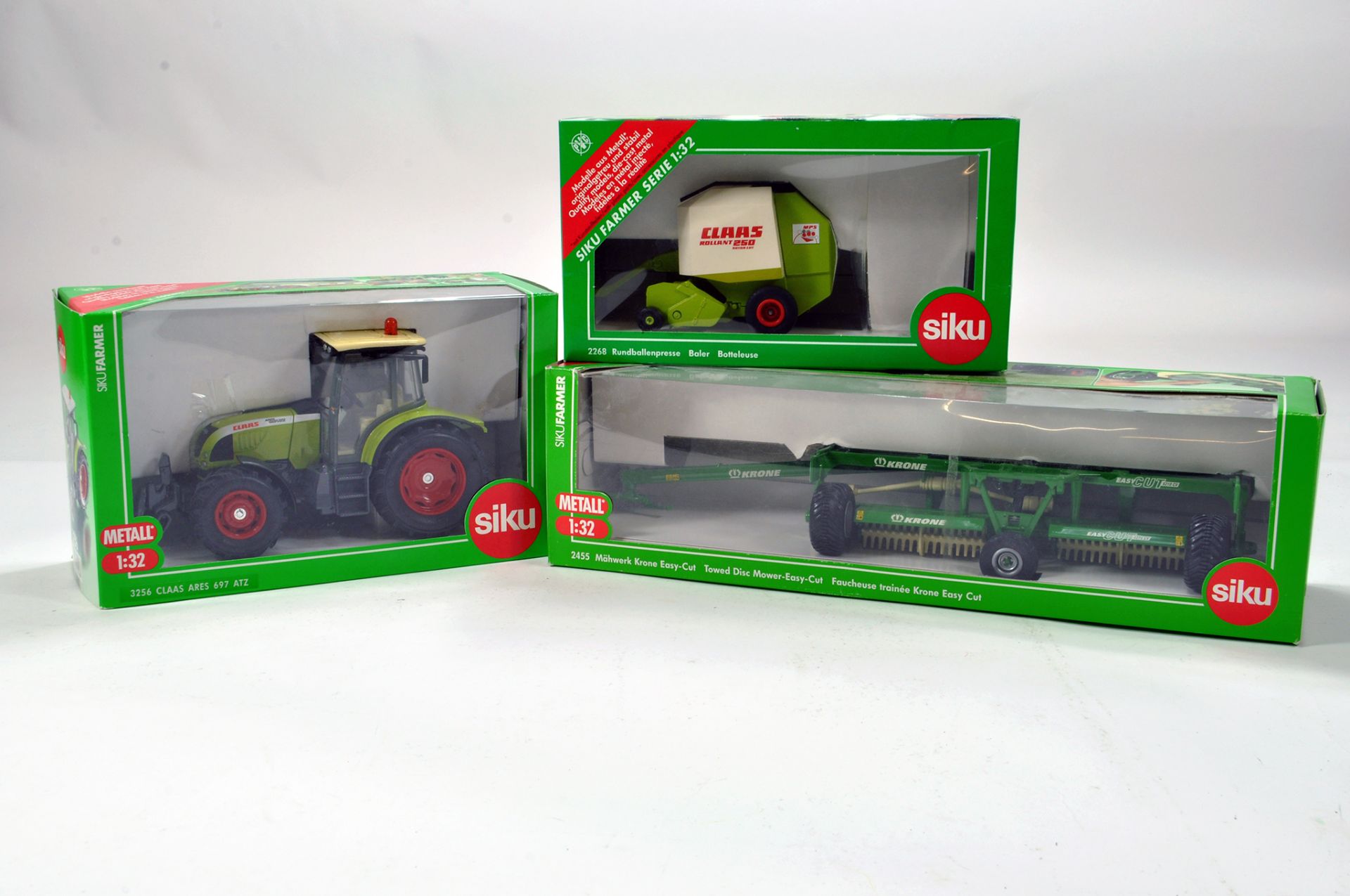 Siku 1/32 Farm Issue Trio comprising Claas and Krone Issues. Generally E to NM. (3)