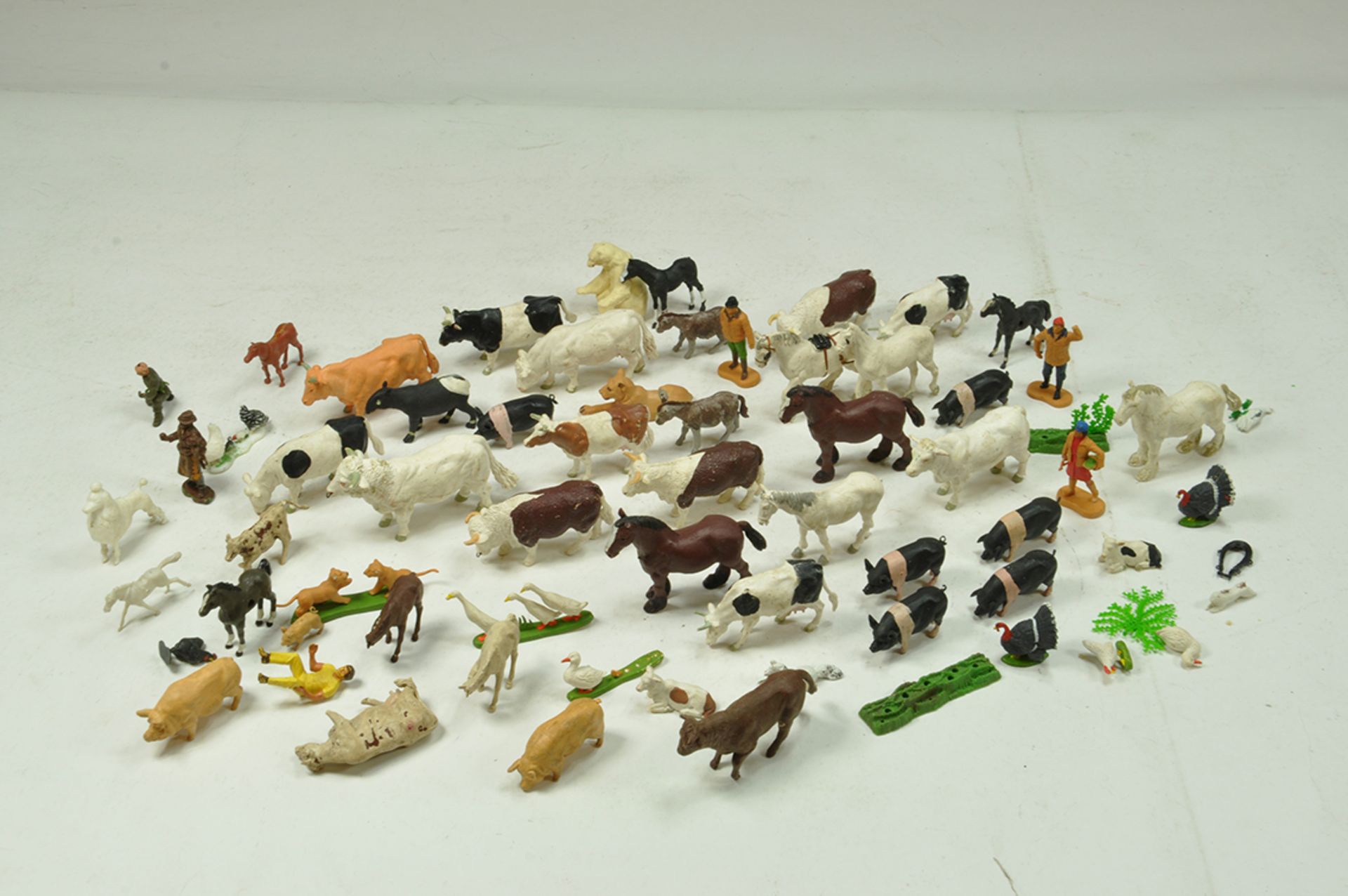 A group of plastic animals from mainly Britains including early Herald issues.