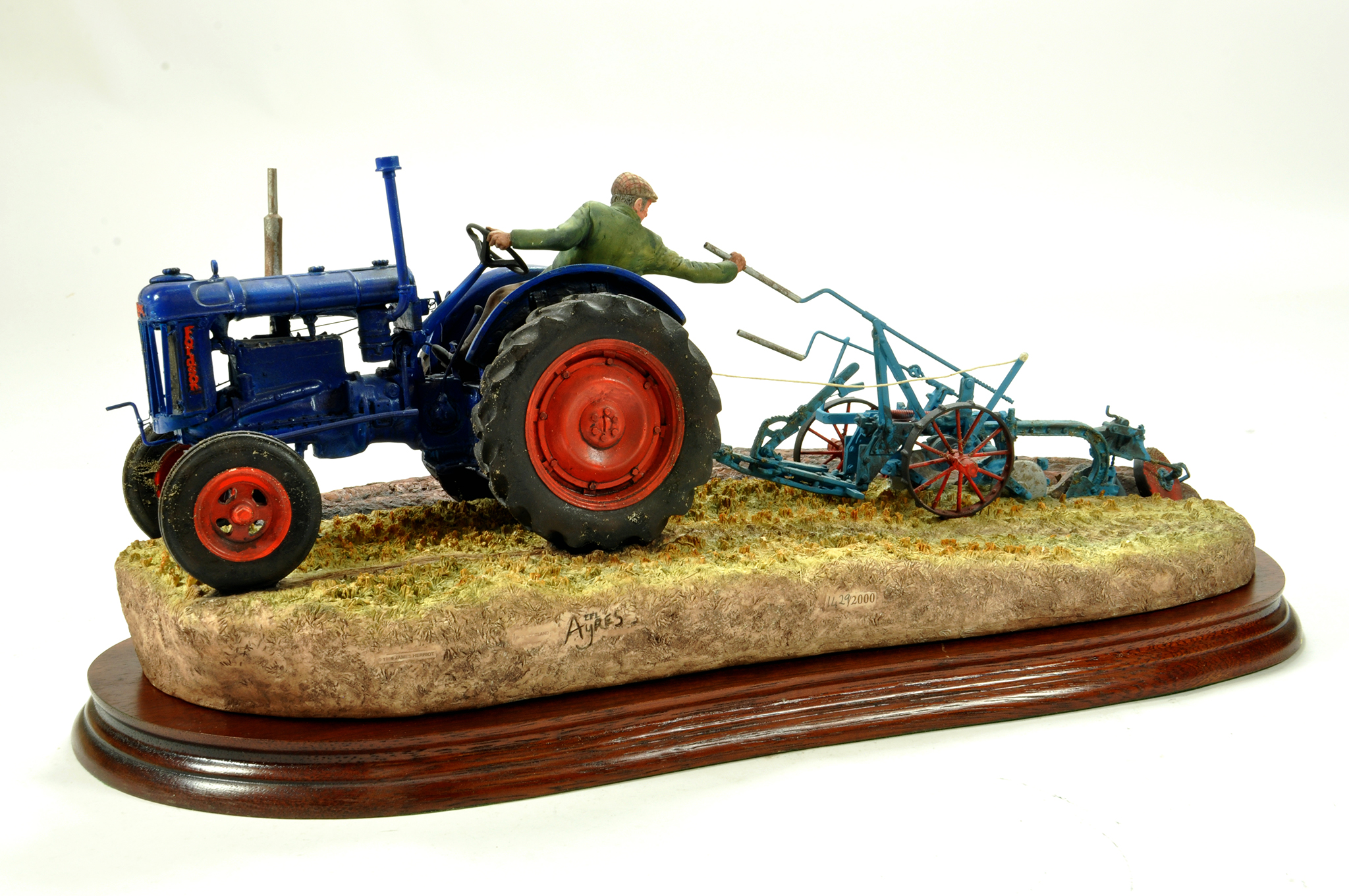 A static presentation piece comprising At the Vintage, a Border Fine Arts model featuring a Fordson