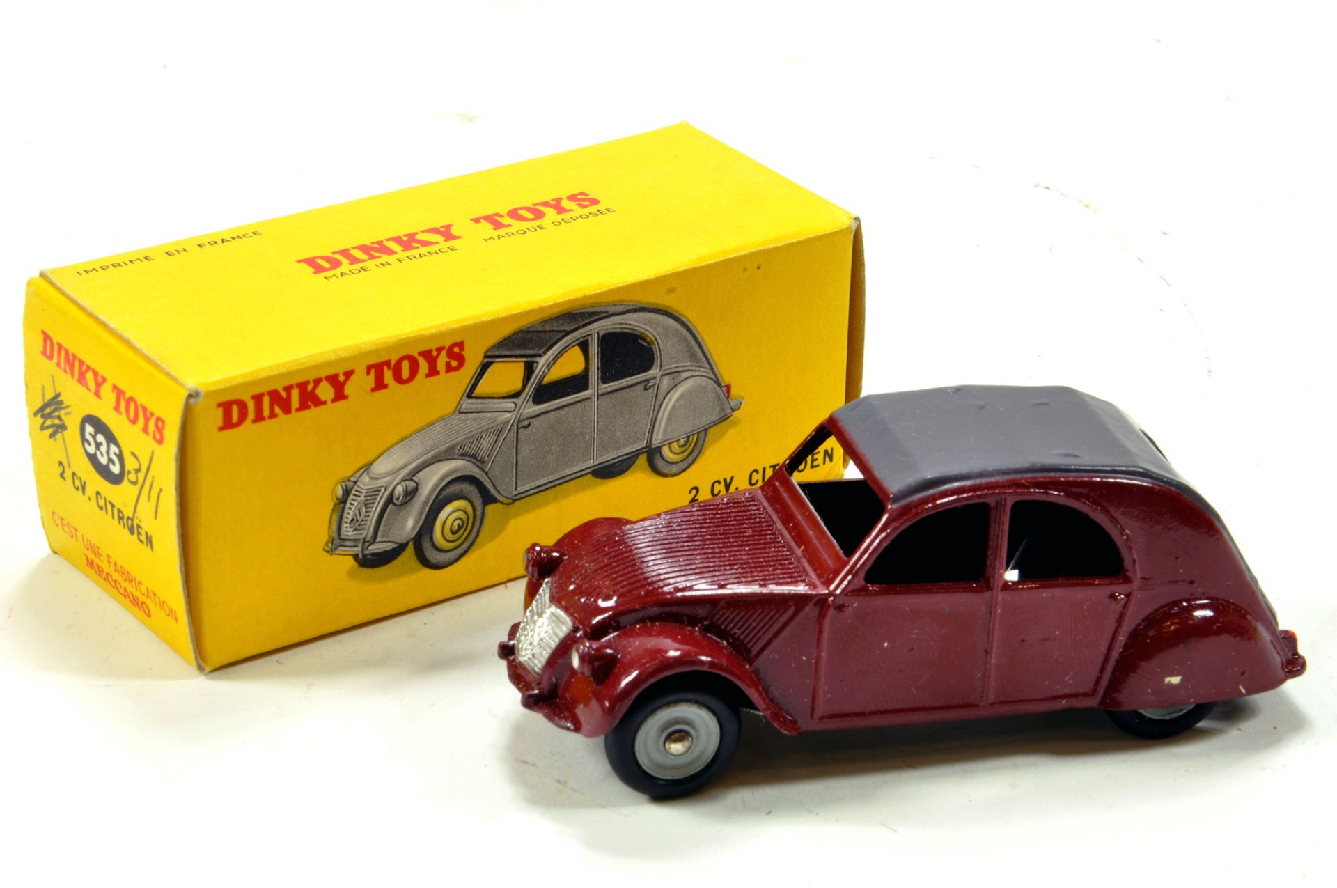 French Dinky No. 535 Citroen 2CV with maroon body and grey roof panel and hubs. E to NM in VG Box.