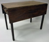 A 19th Century mahogany drop leaf Pembroke table on square supports