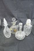 A selection of cut glass decanters and glass jugs to include a Kosta Elis Bergh faceted decanter of