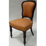 A set of six Victorian mahogany framed dining chairs with upholstered back panels and seats on