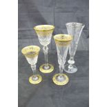 A suite of Saint Louis cut crystal and gilt glasses comprising ten tall wine glasses,