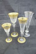 A suite of Saint Louis cut crystal and gilt glasses comprising ten tall wine glasses,