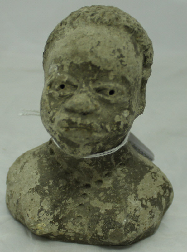 An early 20th Century sculpted clay head of an African woman with necklace, - Image 2 of 3
