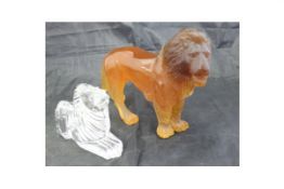 A Daum France amber coloured glass model of a lion,