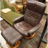 An Ekornes swivel chair and stool,