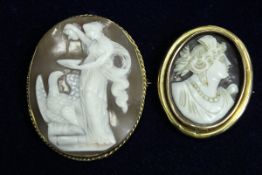 A Victorian gold mounted oval cameo brooch as Zeus seducing Hebe as an eagle together with another