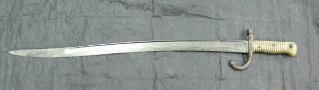 A 19th Century French Saint Etienne 1866 model bayonet with brass handle and shaped blade dated