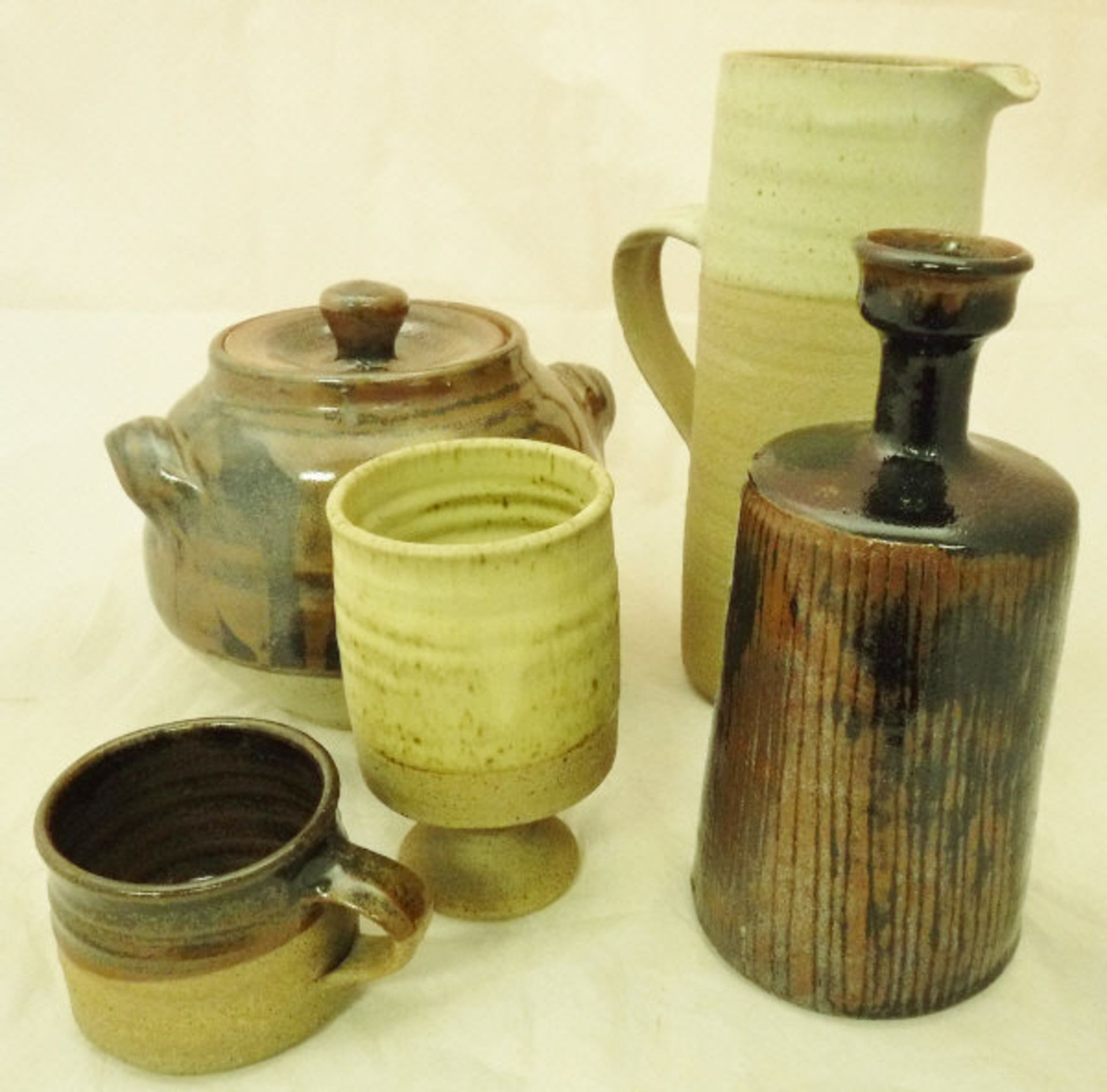 A collection of studio pottery by Colin Pearson to include casserole dish in brown glaze,