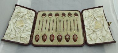 A cased set of twelve silver gilt and enamelled tea or coffee spoons,