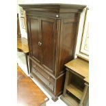 A modern Bassett mahogany linen press / wardrobe,