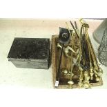 A modern brass three piece fire iron set with claw and ball handles,