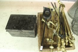 A modern brass three piece fire iron set with claw and ball handles,