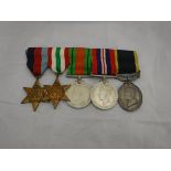 A set of World War II medals comprising the 1939-45 Star, the Italy Star,