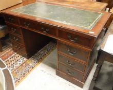A modern reproduction mahogany double pedestal kneehole desk