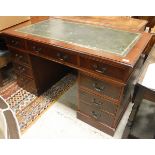 A modern reproduction mahogany double pedestal kneehole desk