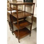 A 19th Century mahogany four tier whatnot with simulated bamboo supports,