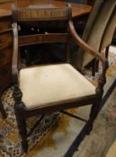 A 19th Century mahogany bar back elbow chair with upholstered seat,