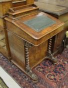 A Victorian walnut and inlaid Davenport desk of typical form with barley-twist front supports