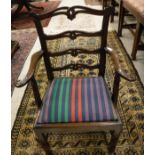 A 19th century mahogany framed carver chair with lotus leaf decorated slat back,
