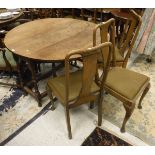 A oak drop leaf table together with four matching dining chairs with column shaped splat to green