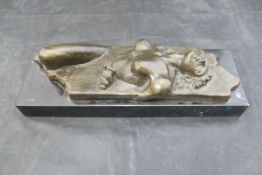 AFTER SETH VANDABLE "Recumbent female nude", on a black marble base,