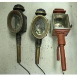 A box containing three various carriage lamps