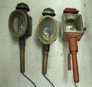 A box containing three various carriage lamps