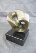 IN THE MANNER OF HENRY MOORE "Abstract form", a verdigris patinated bronze study, unsigned,