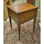 A circa 1900 oak tea or decanter table with double rising top and rising interior,