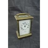 A circa 1900 French lacquered brass cased carriage clock,